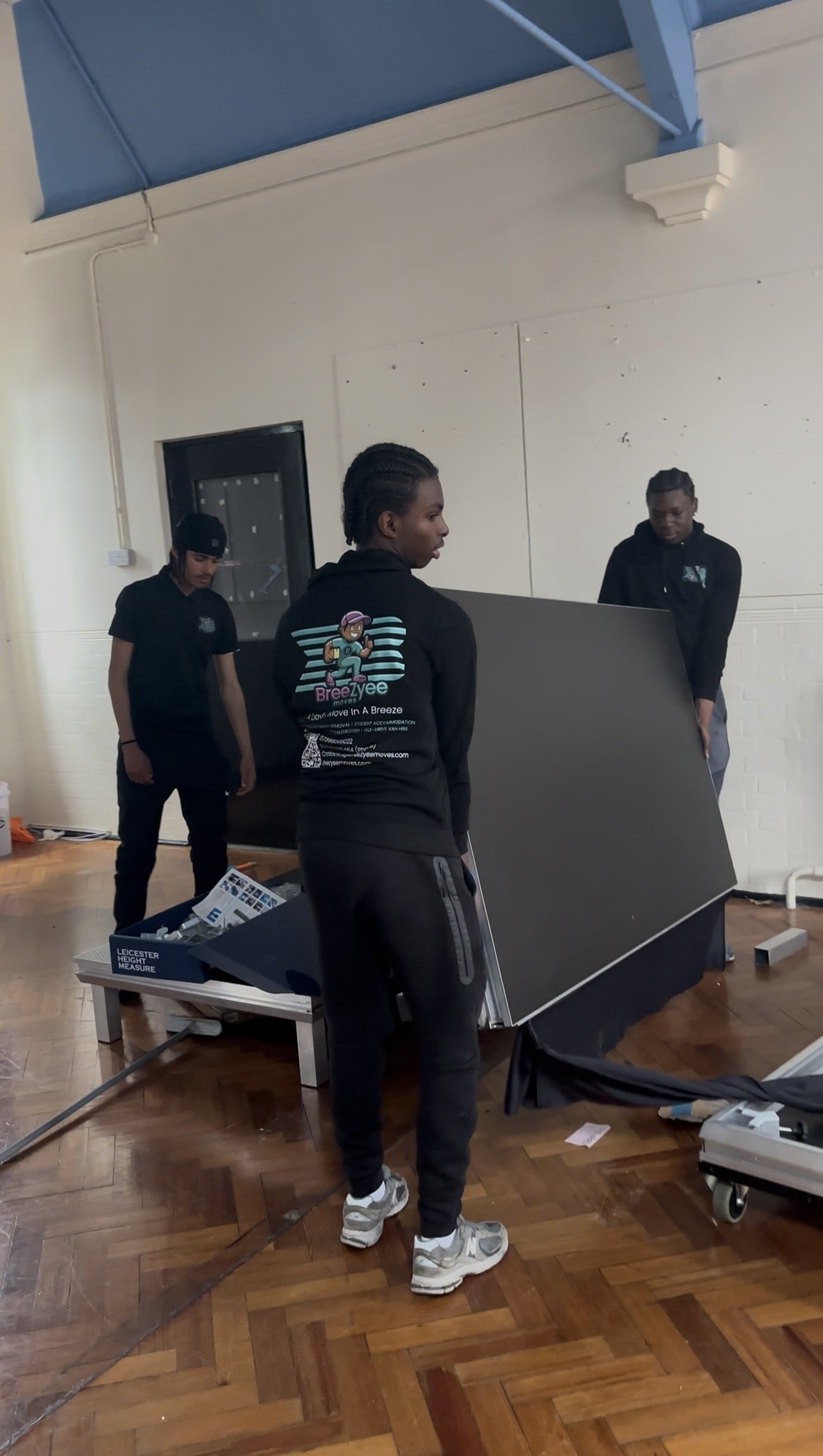Team assembling furniture in residential space